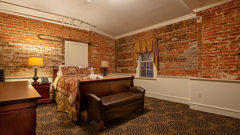 Bedroom with brick walls