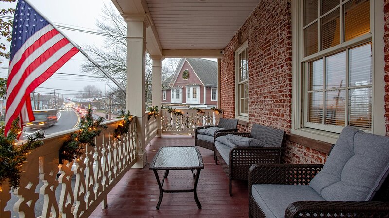Outside balcony with sofas and tables